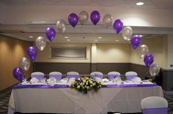 stage suites wedding table balloon arch